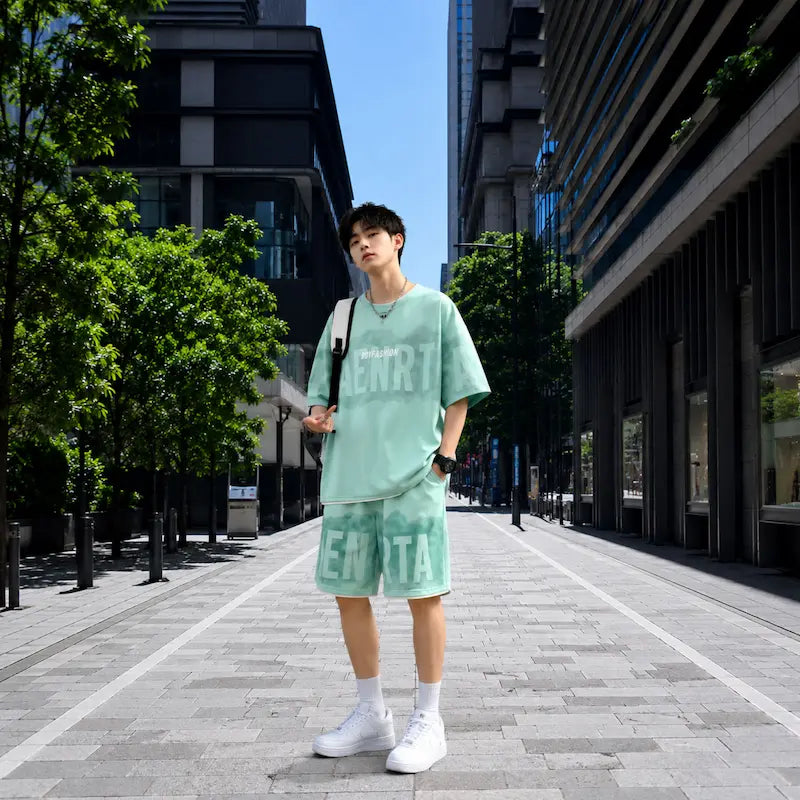 Model wearing a matching oversized t-shirt and shorts co-ord set in a modern urban street.