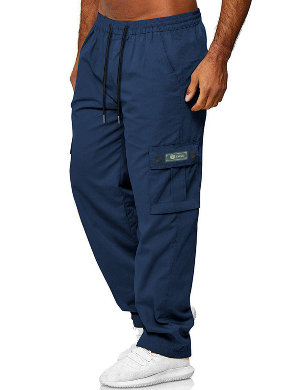 Detailed close up shot of the deep side cargo pocket with reinforced dual stitching on CLOTHRA men full size casual pants.