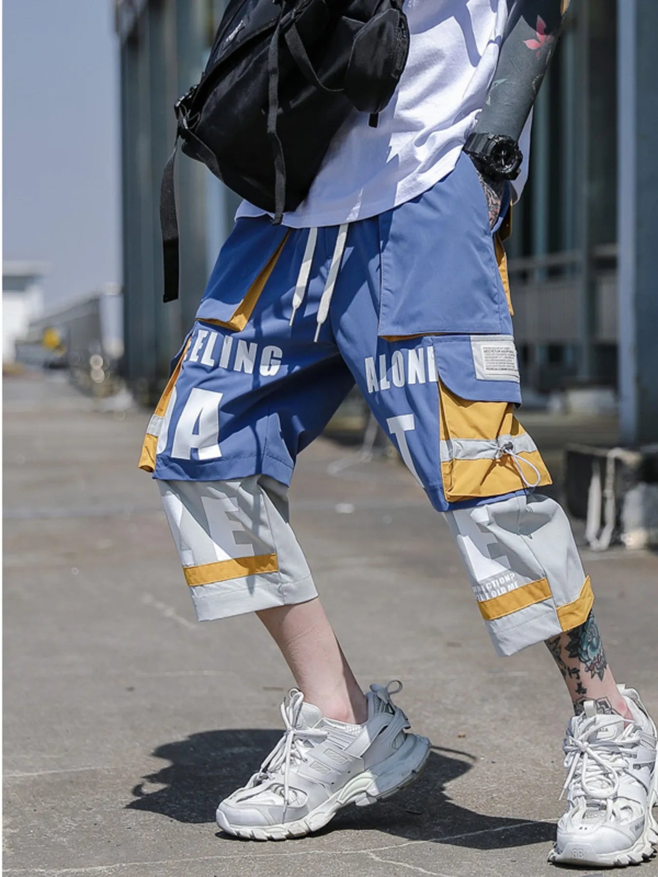 CLOTHRA men plus size color block cargo pants showing a modern contrast panel streetwear look with multi pockets.