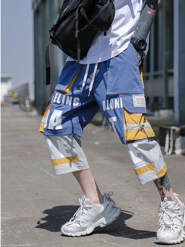 CLOTHRA men plus size color block cargo pants showing a modern contrast panel streetwear look with multi pockets.