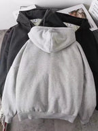 Close up of the warm plush fleece lining interior and smooth metal zipper track on CLOTHRA plus size unisex hoodie Back side view