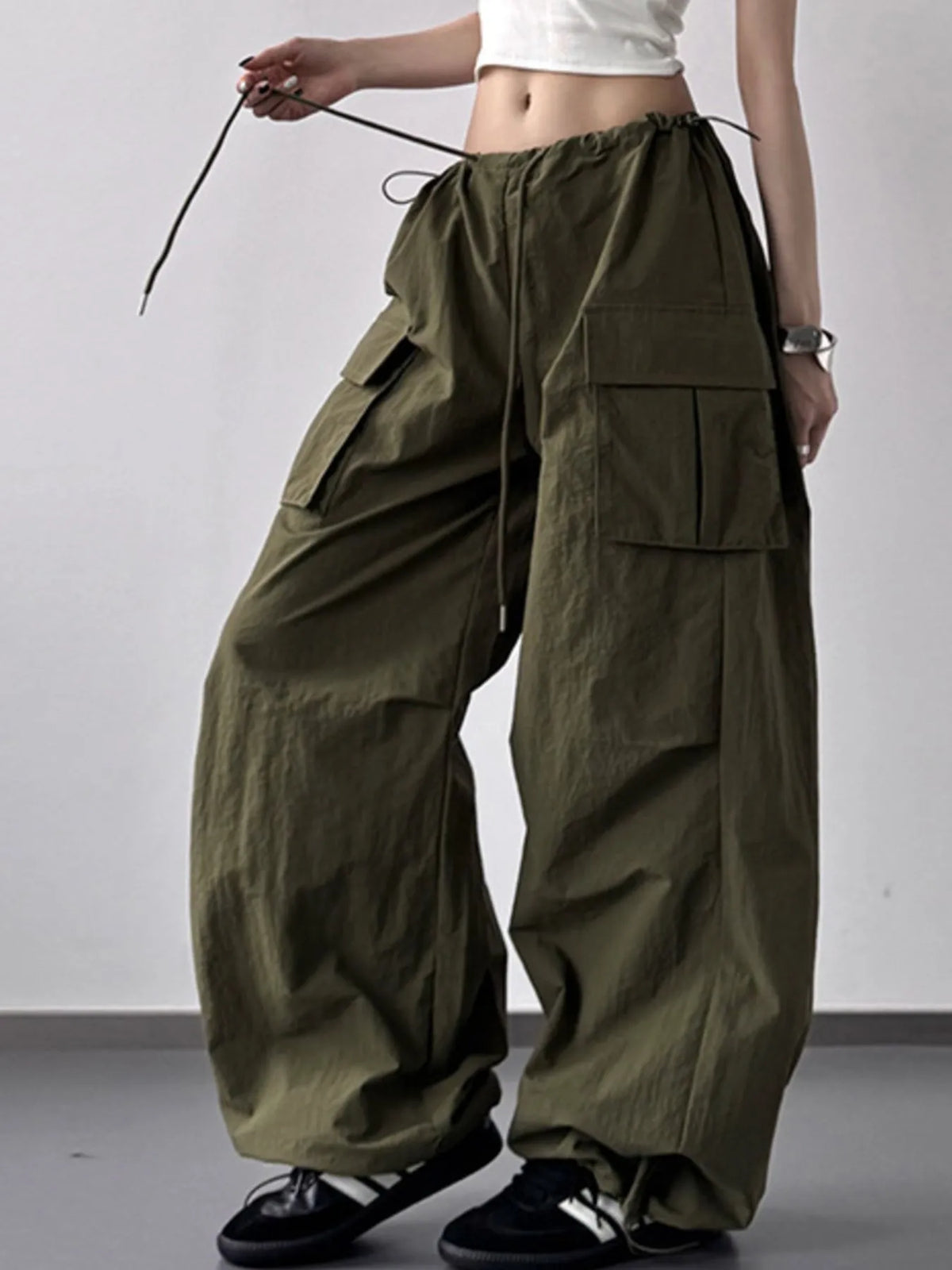 Close up of the heavy duty stitching and secure cargo pocket design on CLOTHRA street style pants.