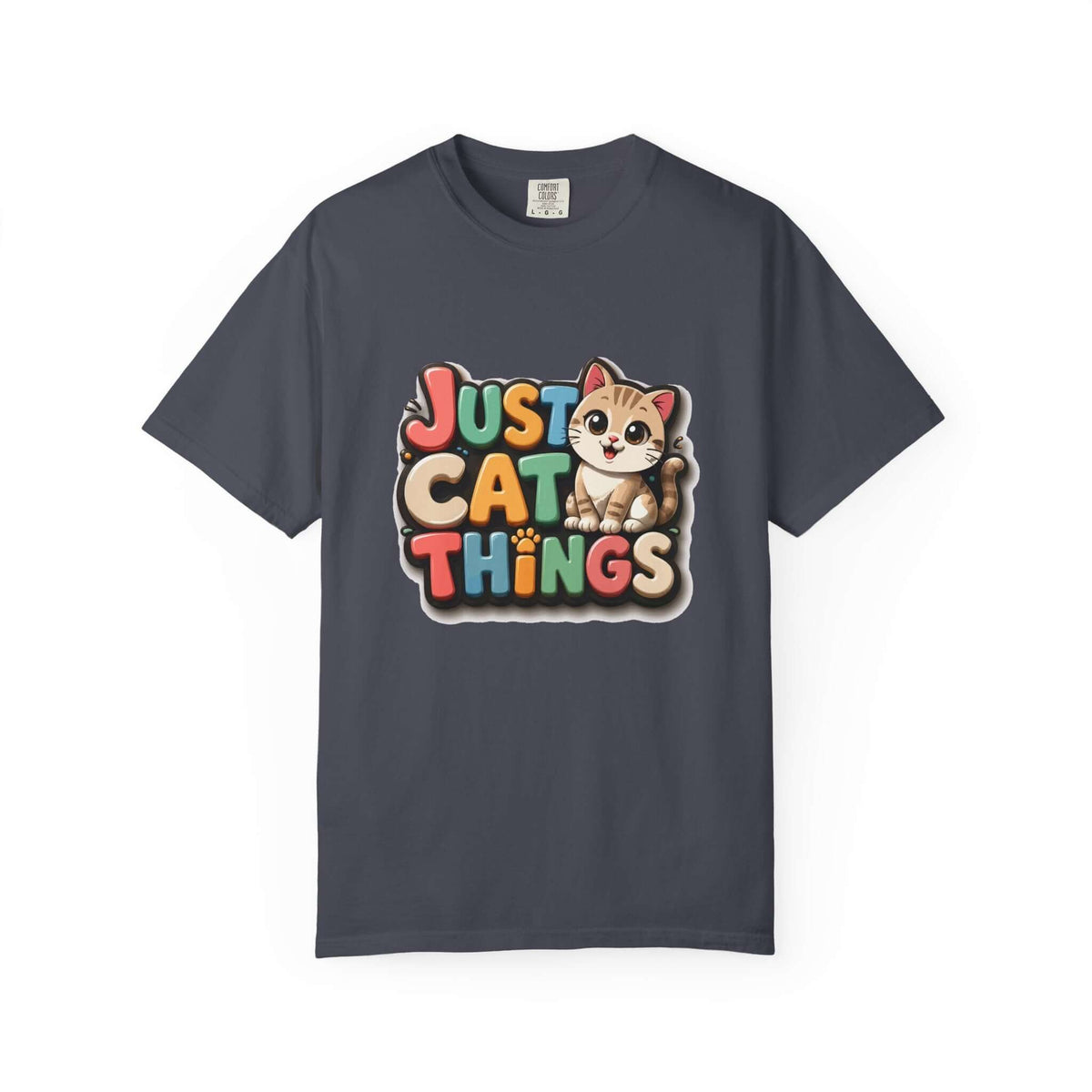 A dark gray crewneck t-shirt featuring a colorful graphic print on the front with the text 'JUST CAT THINGS' in a retro, multi-colored bubble font and a cute cartoon kitten sitting on the lettering.