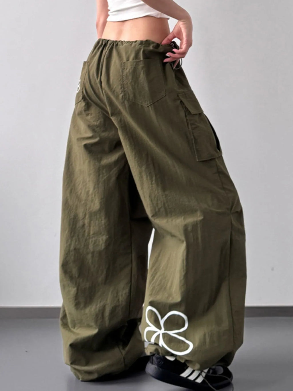 Close up of the heavy duty stitching and secure cargo pocket design on CLOTHRA street style pants. Side View