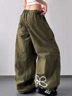 Close up of the heavy duty stitching and secure cargo pocket design on CLOTHRA street style pants. Side View