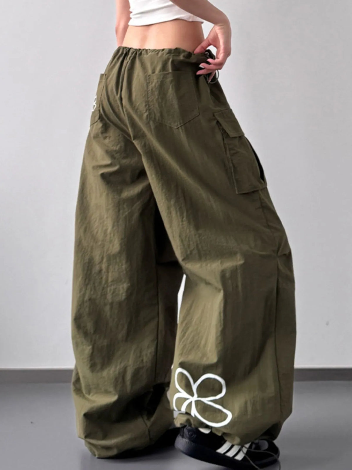 Close up of the heavy duty stitching and secure cargo pocket design on CLOTHRA street style pants. Side View