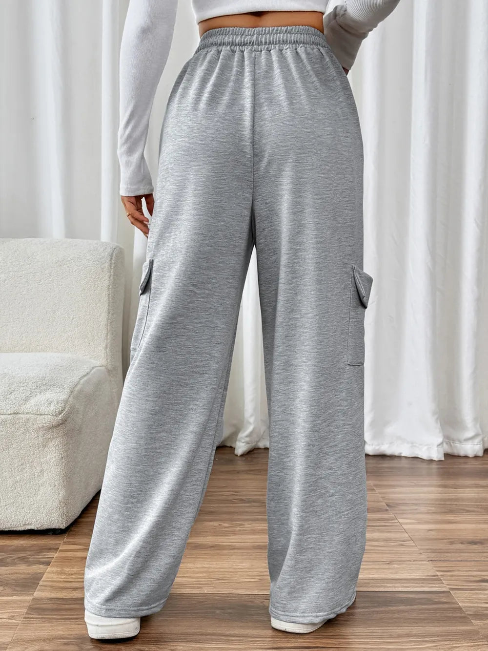 CLOTHRA Perfee cotton blend wide leg drawstring pants with pockets showing a relaxed baggy fluid drape in an authentic urban street look. in a back side view