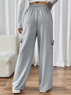 CLOTHRA Perfee cotton blend wide leg drawstring pants with pockets showing a relaxed baggy fluid drape in an authentic urban street look. in a back side view
