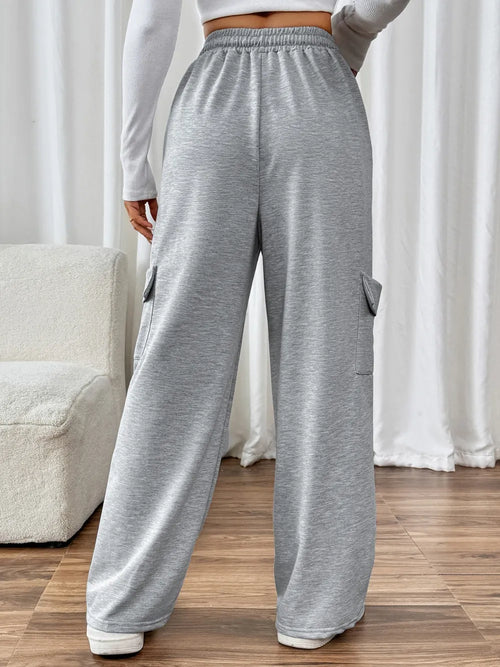 CLOTHRA Perfee cotton blend wide leg drawstring pants with pockets showing a relaxed baggy fluid drape in an authentic urban street look. in a back side view