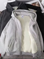 Close up of the warm plush fleece lining interior and smooth metal zipper track on CLOTHRA plus size unisex hoodie