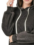 Close up of the high contrast acid wash texture pattern, adjustable drawstrings, and thick double layered hood on CLOTHRA sweatshirt.