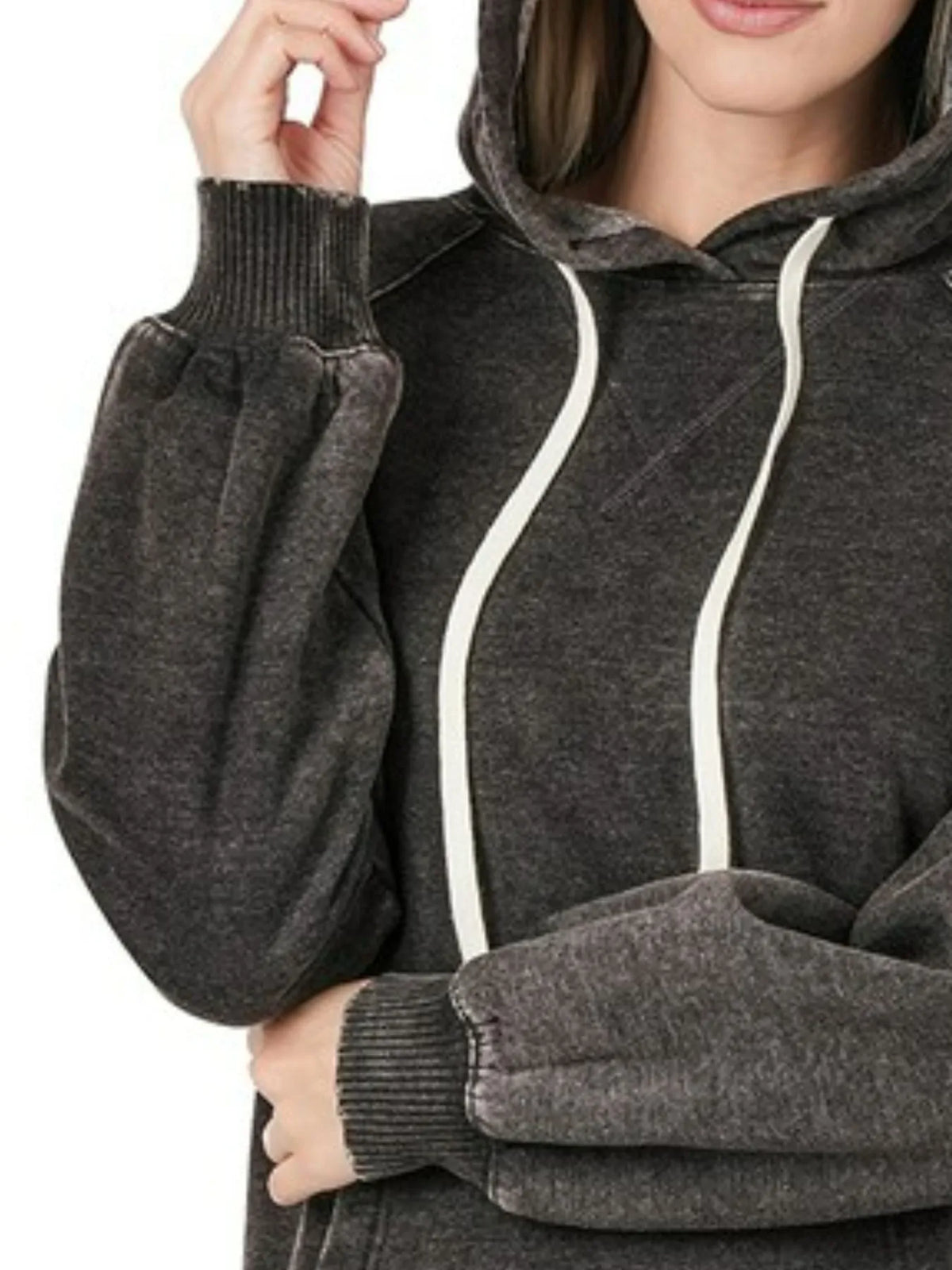 Close up of the high contrast acid wash texture pattern, adjustable drawstrings, and thick double layered hood on CLOTHRA sweatshirt.