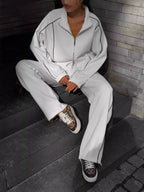 CLOTHRA matching full zip up outerwear jacket and cuffed joggers two piece tracksuit set in a clean urban look. Life style view