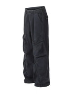 Detailed close up of the spacious side cargo utility pocket with durable double stitching on CLOTHRA men loose fit pants.