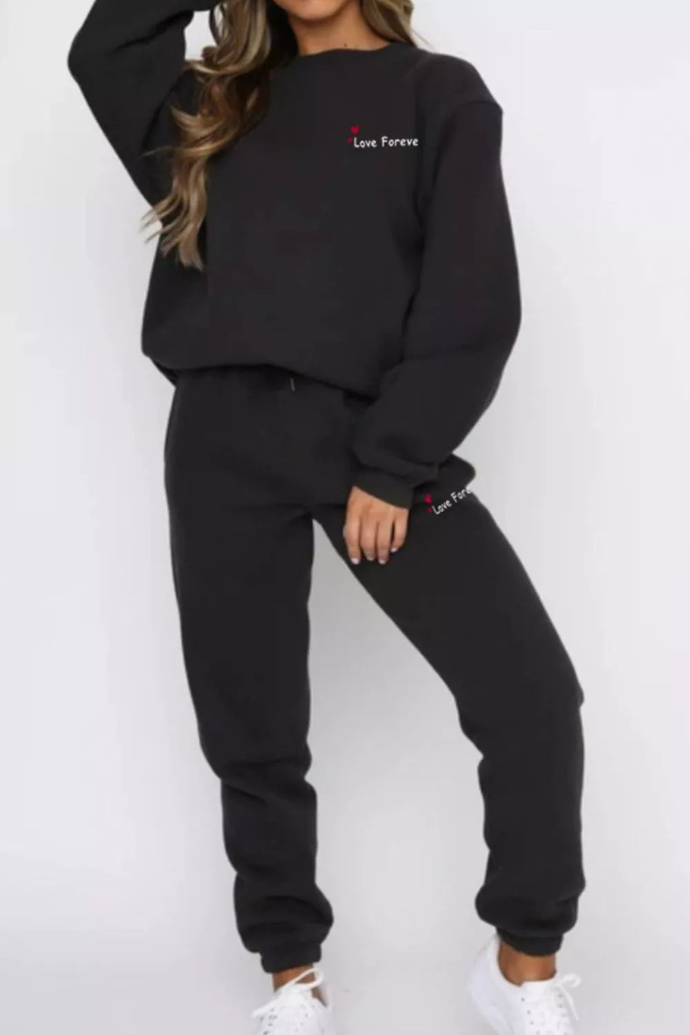 CLOTHRA matching round neck sweatshirt and cuffed joggers two piece lounge tracksuit set in a clean minimalist street look. Black