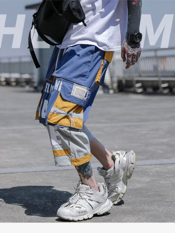 Close up of the wide elastic waistband and adjustable front drawstring on CLOTHRA men plus size contrast trousers.