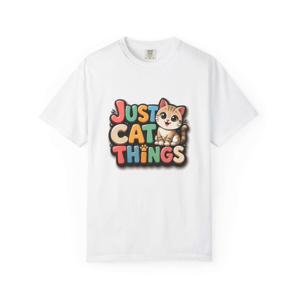 A white short-sleeve crewneck t-shirt featuring a colorful graphic on the chest that reads 'JUST CAT THINGS' in a retro, multi-colored bubble font, with a cute cartoon cat sitting on the lettering.