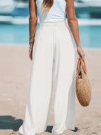 CLOTHRA full size plus size wide leg drawstring pants showing an elongated relaxed vertical drape in an authentic street fashion look. Back side view n a color White
