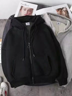 Close up of the warm plush fleece lining interior and smooth metal zipper track on CLOTHRA plus size unisex hoodie in a color Black