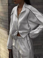 Close up of the smooth front zipper closure and high neck collar profile on CLOTHRA street style outerwear jacket.