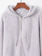 Detailed close up of the deep side hand pockets and ultra-soft woven fleece fabric texture on CLOTHRA unisex outerwear. in a color Light Grey