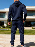 CLOTHRA men's plus size matching half zip hoodie and multi pocket cargo pants two piece utility tracksuit set in a clean urban look. in a color Navy Blue Back side view