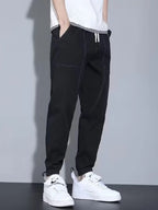 Close up shot of the soft elastic ankle cuffs and premium non see through polyester knit weave on CLOTHRA matching joggers.