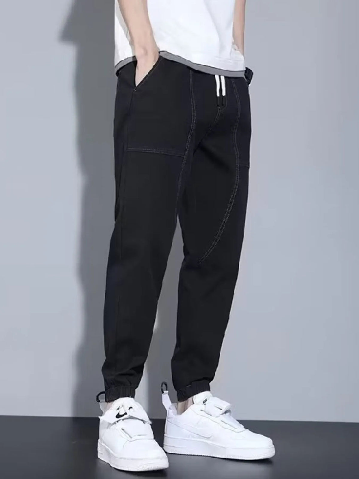 Close up shot of the soft elastic ankle cuffs and premium non see through polyester knit weave on CLOTHRA matching joggers.
