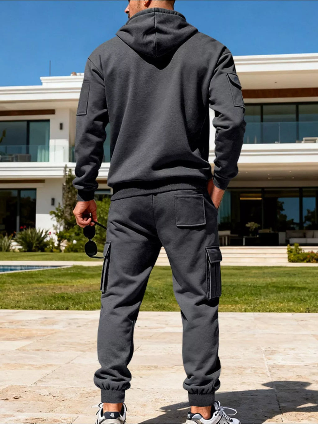 CLOTHRA men's plus size matching half zip hoodie and multi pocket cargo pants two piece utility tracksuit set in a clean urban look. Back side view in Dark Grey color
