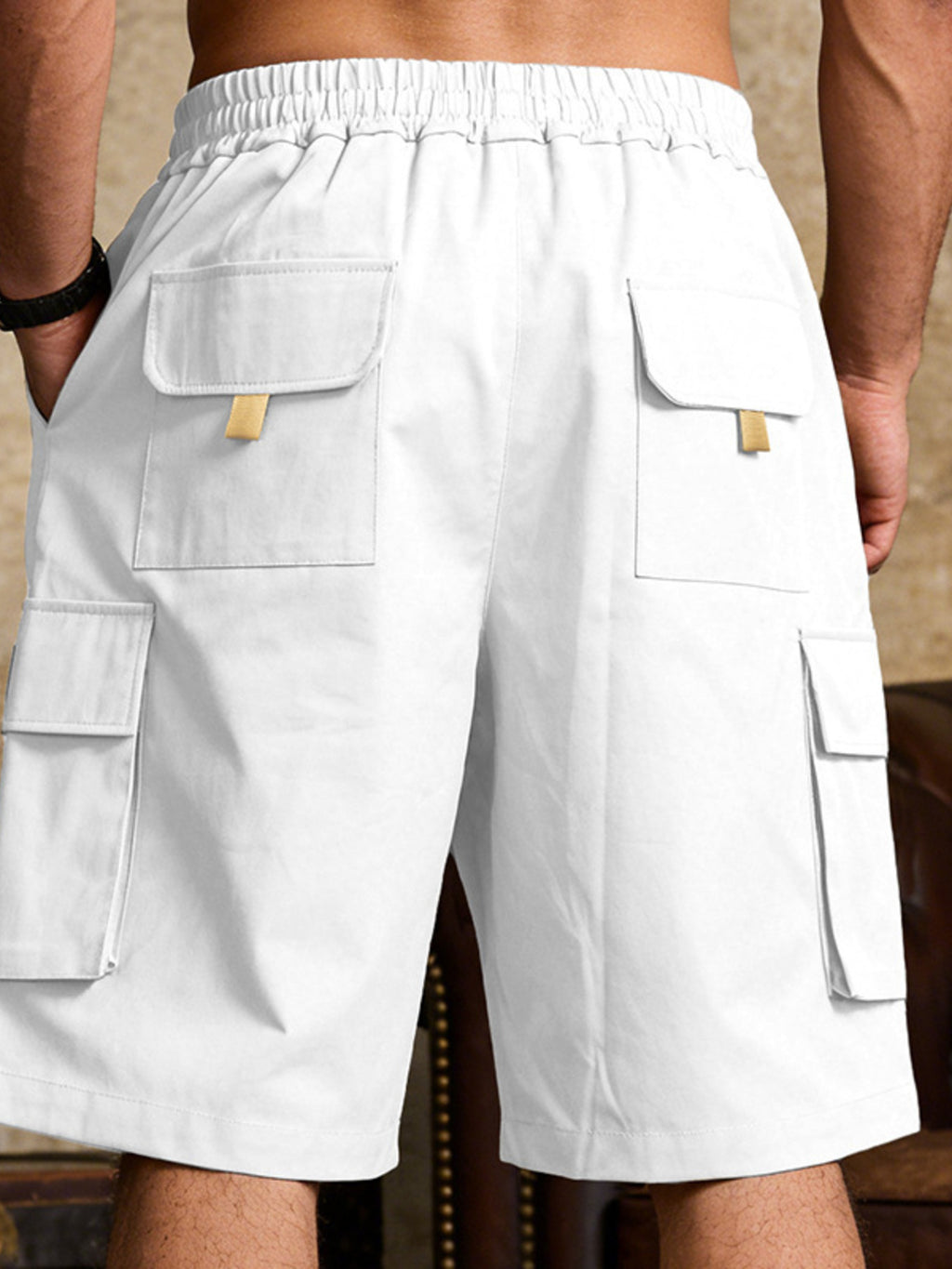 Close up of the wide non-roll elastic waistband and adjustable front drawstring on CLOTHRA men plus size shorts. Back side view in color White