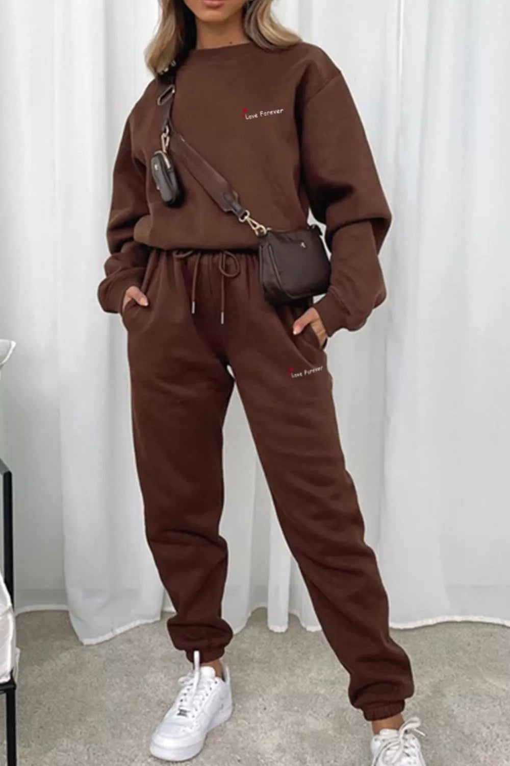 CLOTHRA matching round neck sweatshirt and cuffed joggers two piece lounge tracksuit set in a clean minimalist street look.