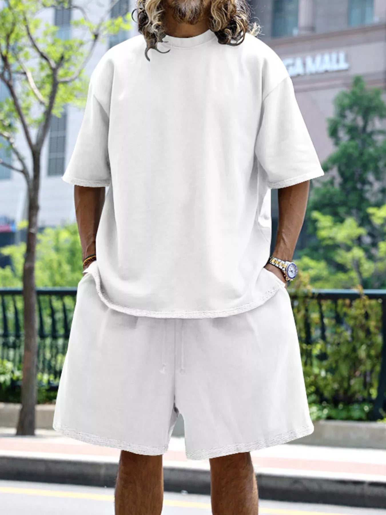 Close up of the deep reinforced side pocket and flexible wide elastic waistband on CLOTHRA plus size matching shorts. in a color White