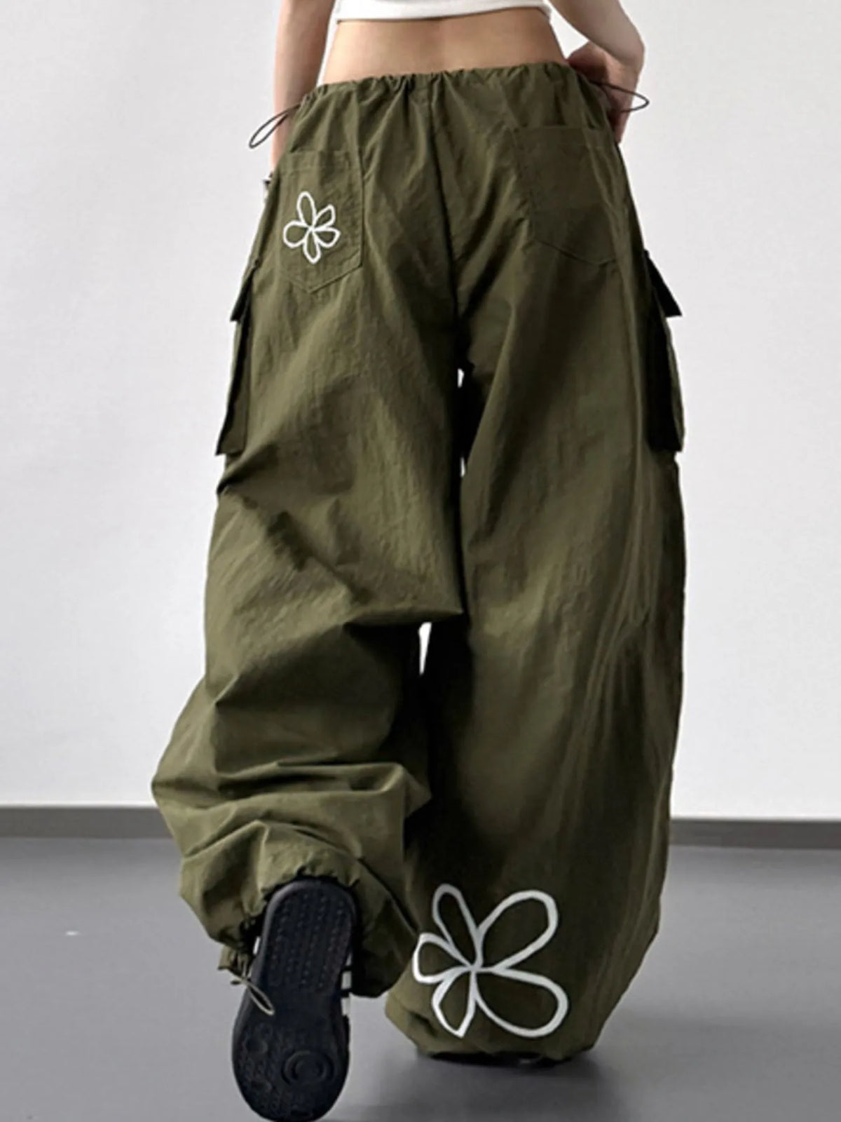 CLOTHRA baggy wide leg utility cargo pants with adjustable drawstring waist and deep multi pocket design. Back view