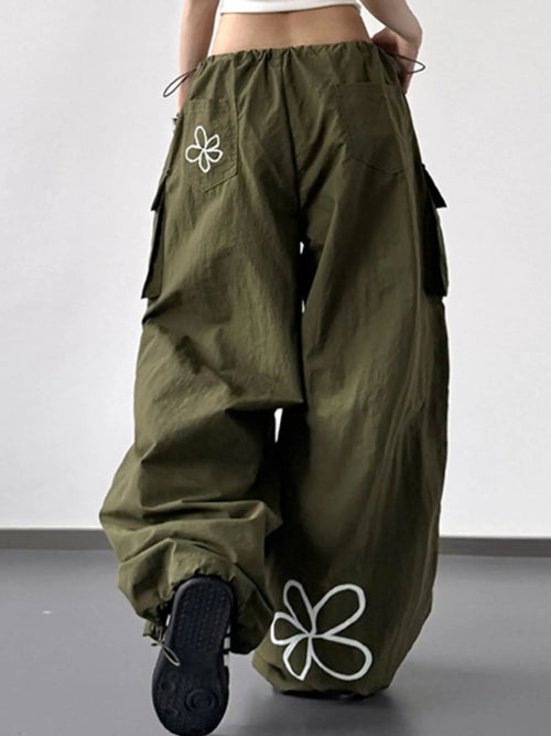 CLOTHRA baggy wide leg utility cargo pants with adjustable drawstring waist and deep multi pocket design. Back view
