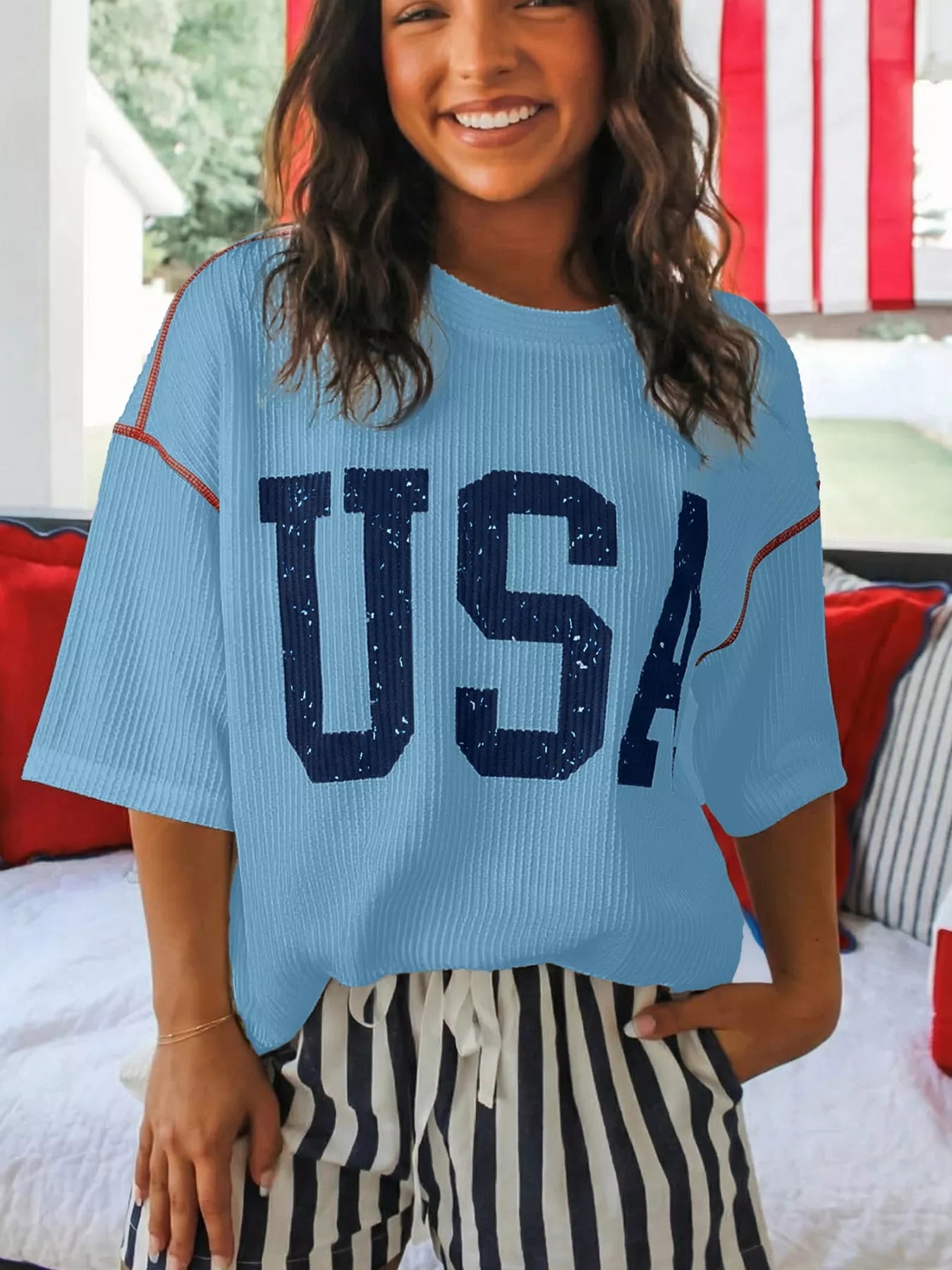 CLOTHRA unisex usa graphic ribbed knit t-shirt showing a modern versatile fit and unique contrast stitching accents.