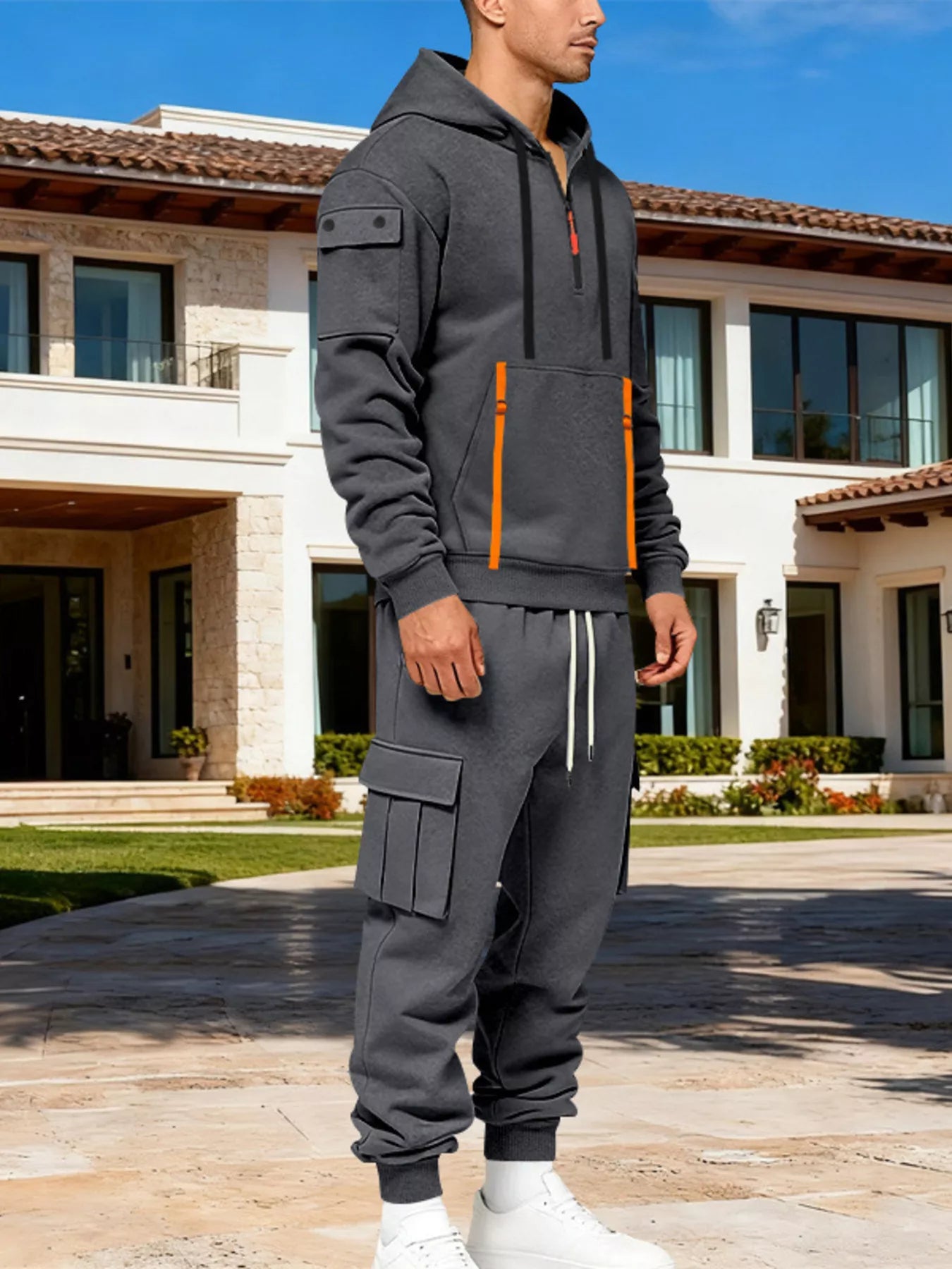 CLOTHRA men's plus size matching half zip hoodie and multi pocket cargo pants two piece utility tracksuit set in a clean urban look. Close -up shot