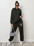 CLOTHRA matching drop shoulder graphic hoodie and cuffed sweatpants two piece streetwear tracksuit set in an oversized urban look.