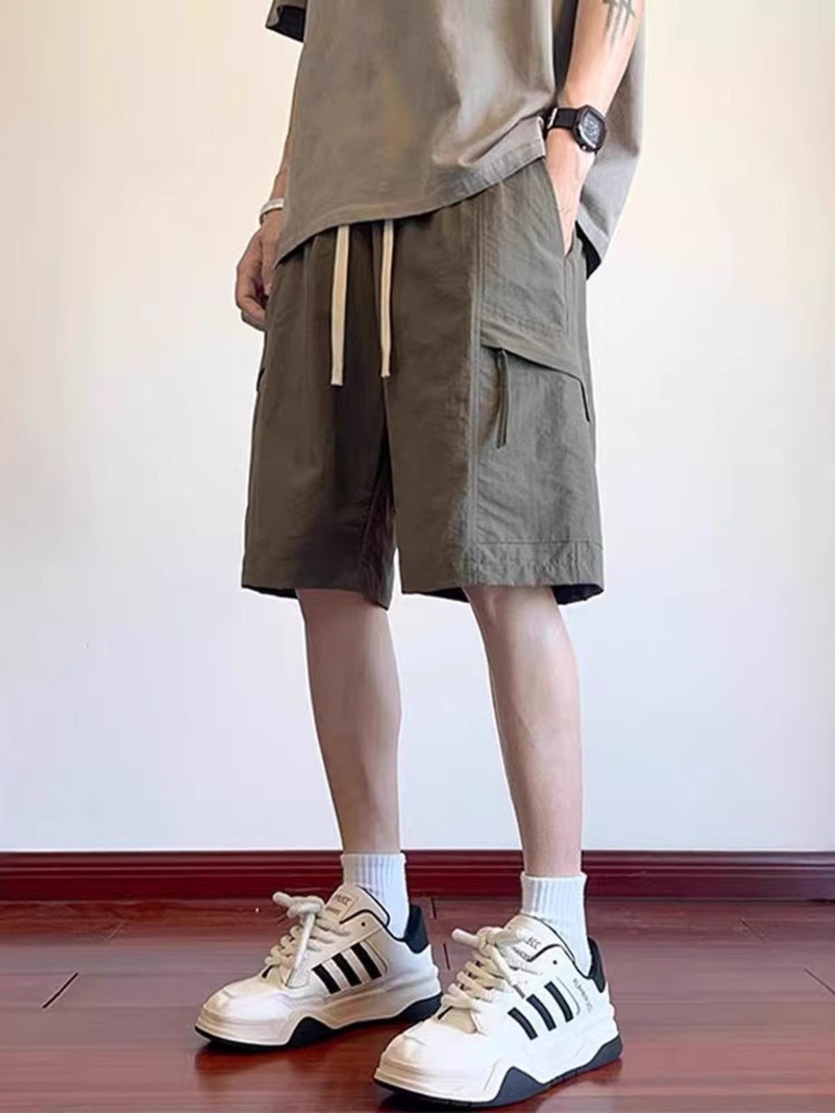 CLOTHRA men plus size lightweight breathable cargo shorts showing a comfortable relaxed fit streetwear style. in a color Green