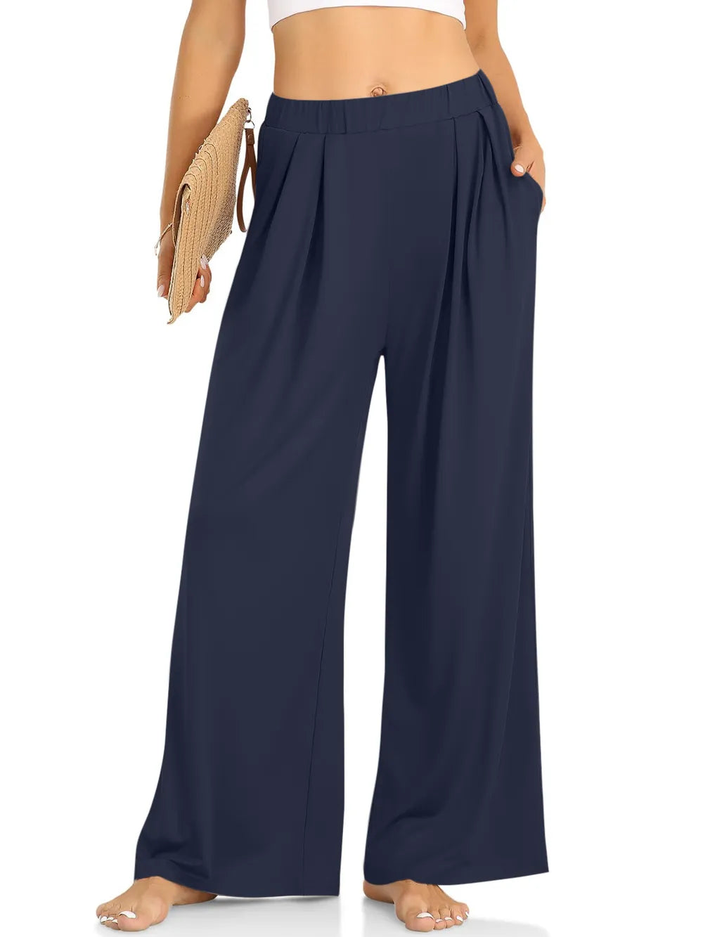 CLOTHRA minimalist elastic waist wide leg pants showing a relaxed baggy fluid drape in an authentic urban street look. in a color Dark Blue