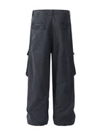 Close up of the secure waist closure and reinforced side slash pockets on CLOTHRA men cargo trousers back side view