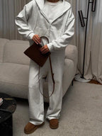 CLOTHRA matching full zip up hoodie and cuffed sweatpants two piece premium cotton tracksuit set in a relaxed urban look. Style view