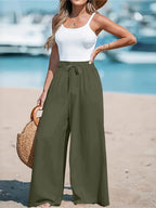 Close up of the adjustable front tied drawstring cords and secure wide flat waistband on CLOTHRA plus size trousers. in a color Army Green
